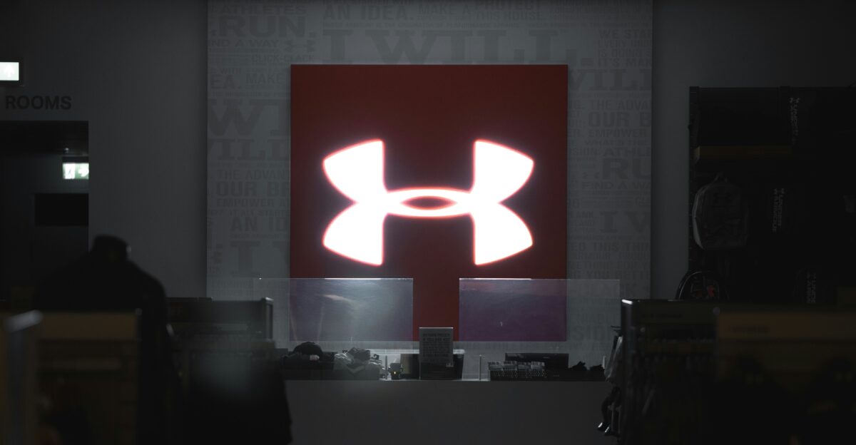 a computer store with a large logo on the wall