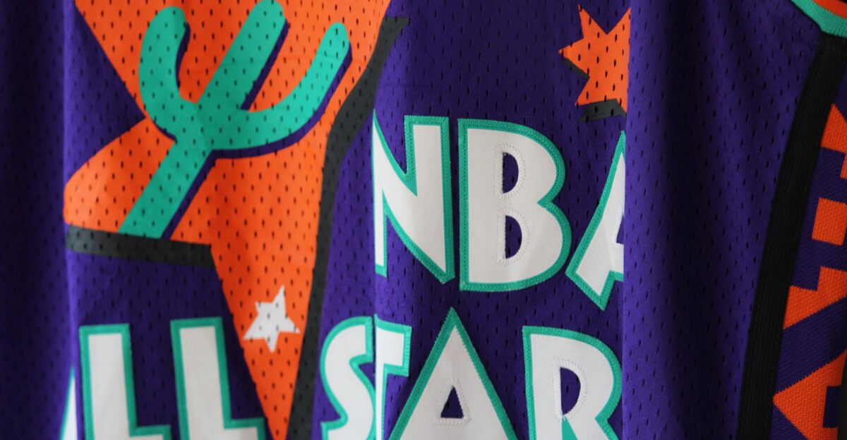 a close up of a basketball jersey with a cactus on it